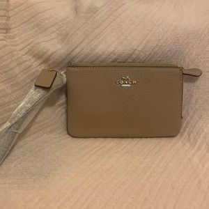 Brand new Coach double zip wristlet taup